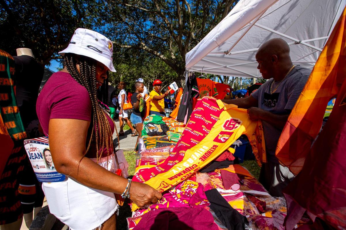 Bethune-Cookman University alumnus Elena Robinson shops for collegiate attire during the 6th Annual South Florida HBCU Picnic at Florida Memorial University in Miami Gardens, Florida, on Saturday, July 9, 2022.