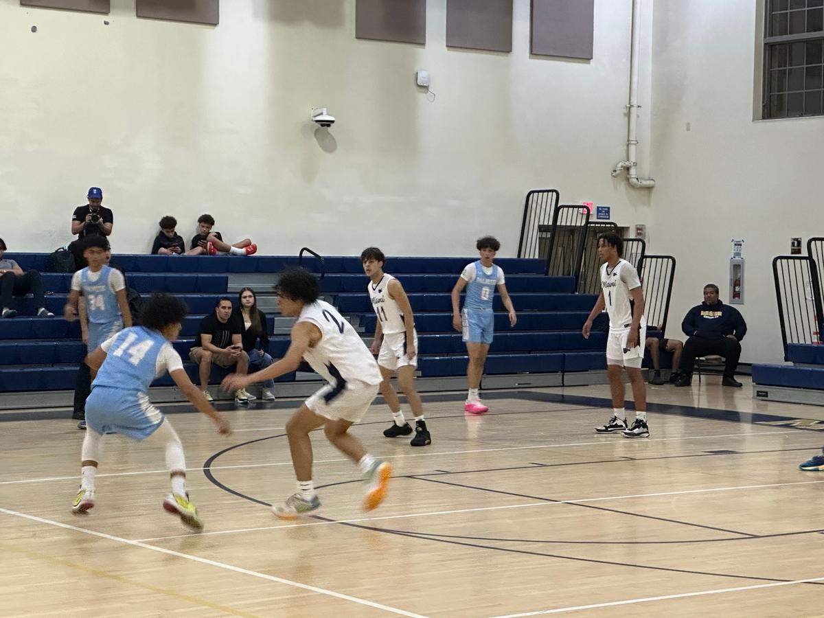 Miami High guard Gabriel Fernandez defends Palmetto’s Santiago Henriquez during Thursday’s District 16-7A semifinal at the Miami High gym.