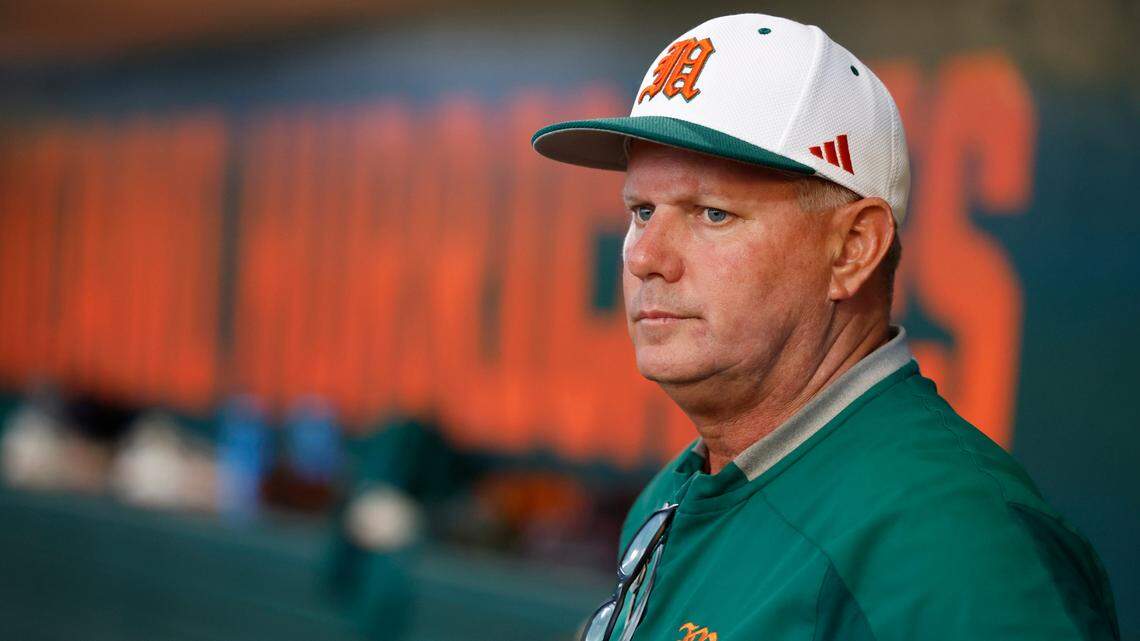 Miami Hurricanes head coach Gino DiMare looks out from the dugout before the start of the game against the Texas Longhorns in the Coral Gables Regional of the NCAA Division I Baseball Championship at Alex Rodriguez Park at Mark Light Field in Coral Gables on Saturday, June 3, 2023.