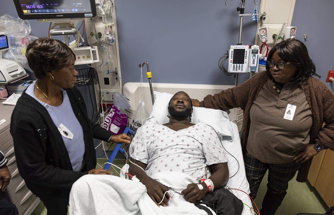 Chevon Byfield, 39, who suffers from heart failure and relies on a left ventricular assist device (LVAD), talks with his grandmother, Brylon Brown, left, and his mother, Sharon Brown, before heading to his procedure at Memorial Regional Hospital on Tuesday, Feb. 3, 2026, in Hollywood, Fla. 