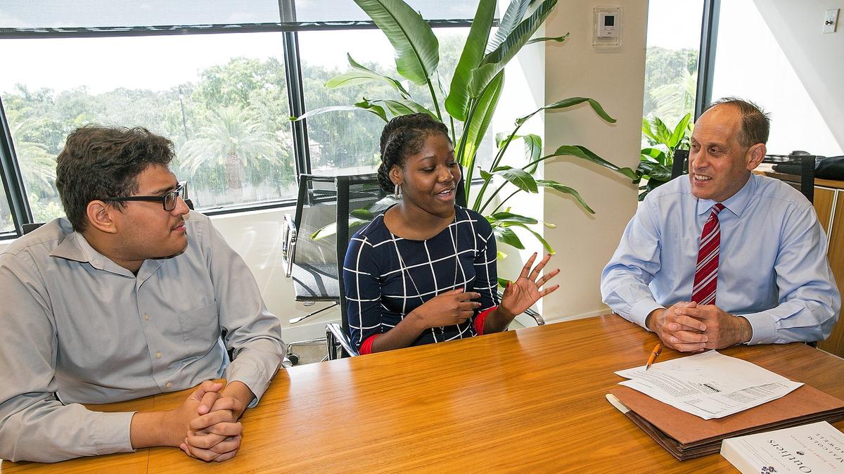 Miami accounting firm Gerson Preston has hired two interns from the Miami Summer Jobs Connect program for low-income youths. From left, intern Andres Arcia, intern Hilairee Lubin and Gerson Preston accountant Stuart Rohatiner, who is a firm partner.