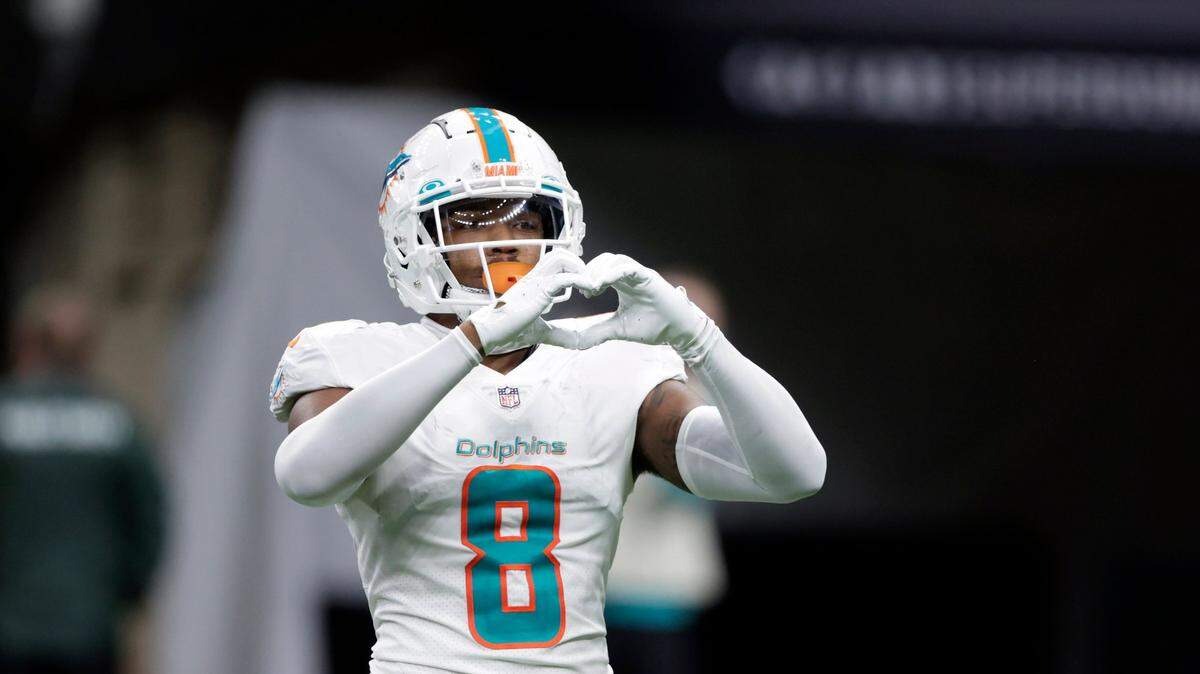 Miami Dolphins free safety Jevon Holland (8) signals to teammates during the second half of an NFL football game against the New Orleans Saints Monday, Dec. 27, 2021, in New Orleans. The Dolphins won 20-3. (AP Photo/Butch Dill)