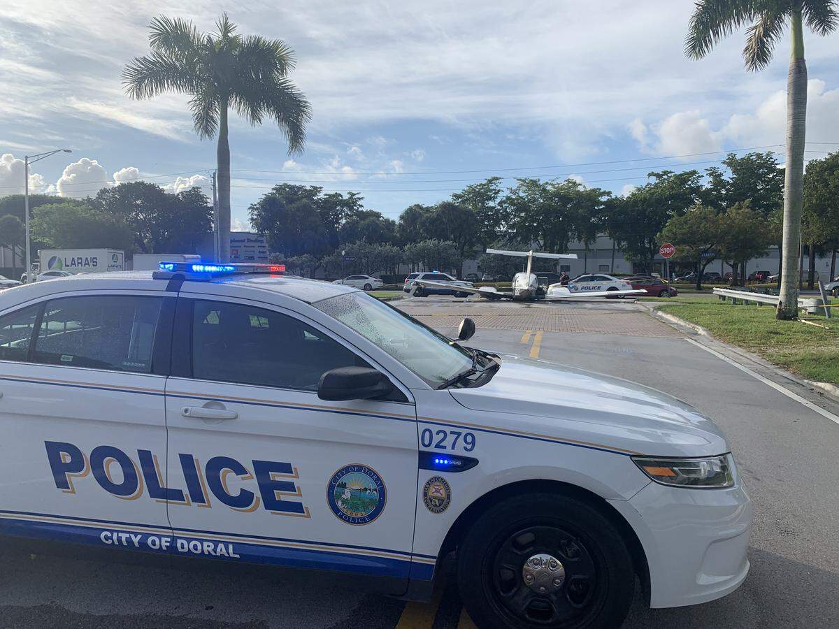 A small plane crash-landed in Doral near Miami-Dade Police headquarters. It remained on the street Monday morning.