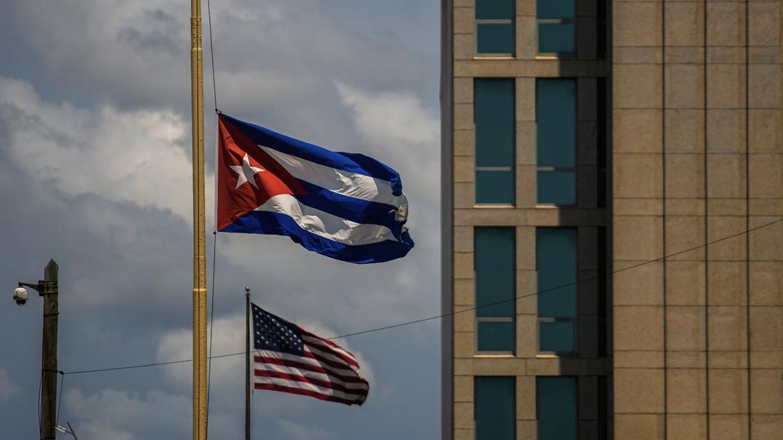 A Cuban flag flies next to an American flag outside the U.S. Embassy in Havana, Cuba on May 17.
