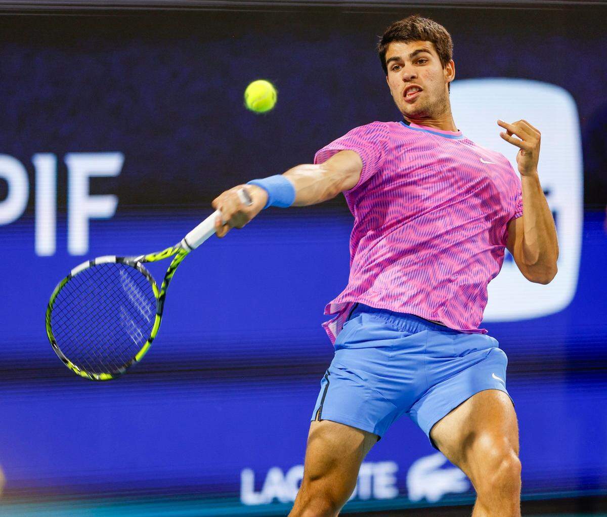 Carlos Alcaraz of Spain returns a serve during the match against Grigor Dimitrov of Bulgaria during the Miami Open Tennis Tournament at Hard Rock Stadium in Miami Gardens, Florida on Thursday, March 28, 2024.