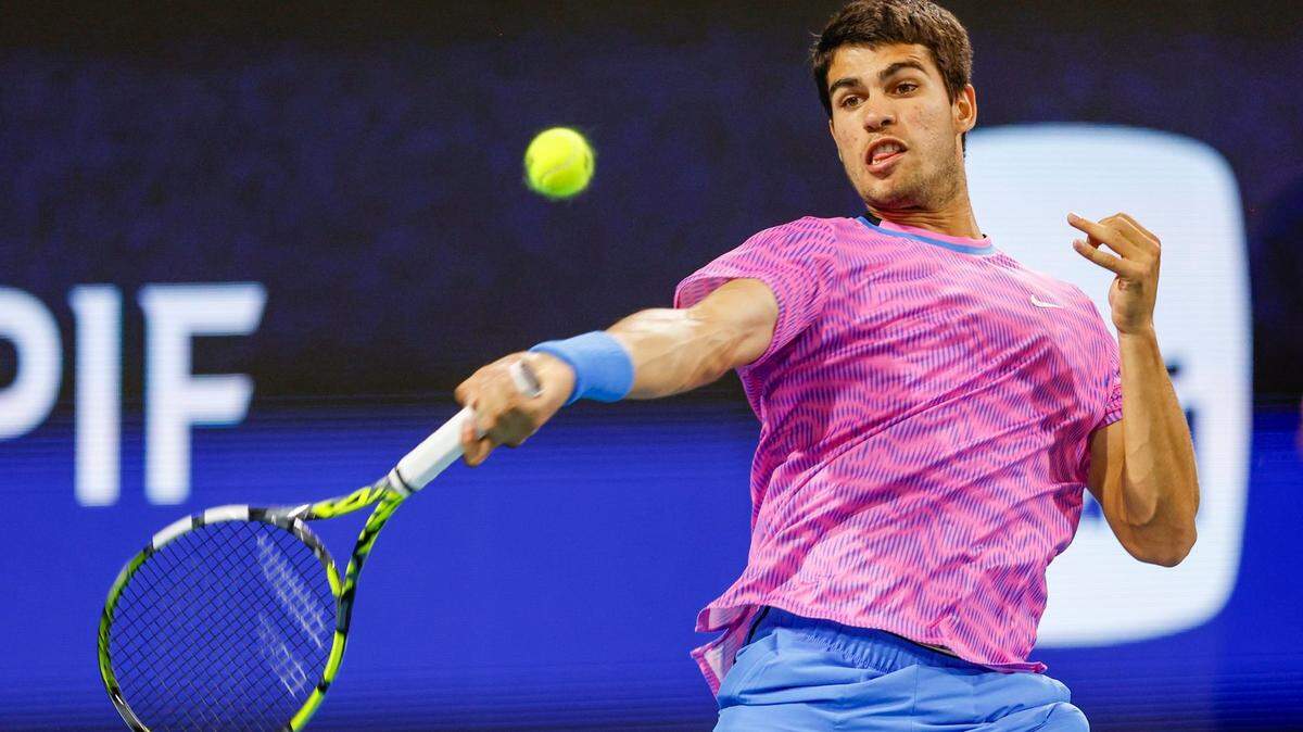Carlos Alcaraz of Spain returns a serve during the match against Grigor Dimitrov of Bulgaria during the Miami Open Tennis Tournament at Hard Rock Stadium in Miami Gardens, Florida on Thursday, March 28, 2024.
