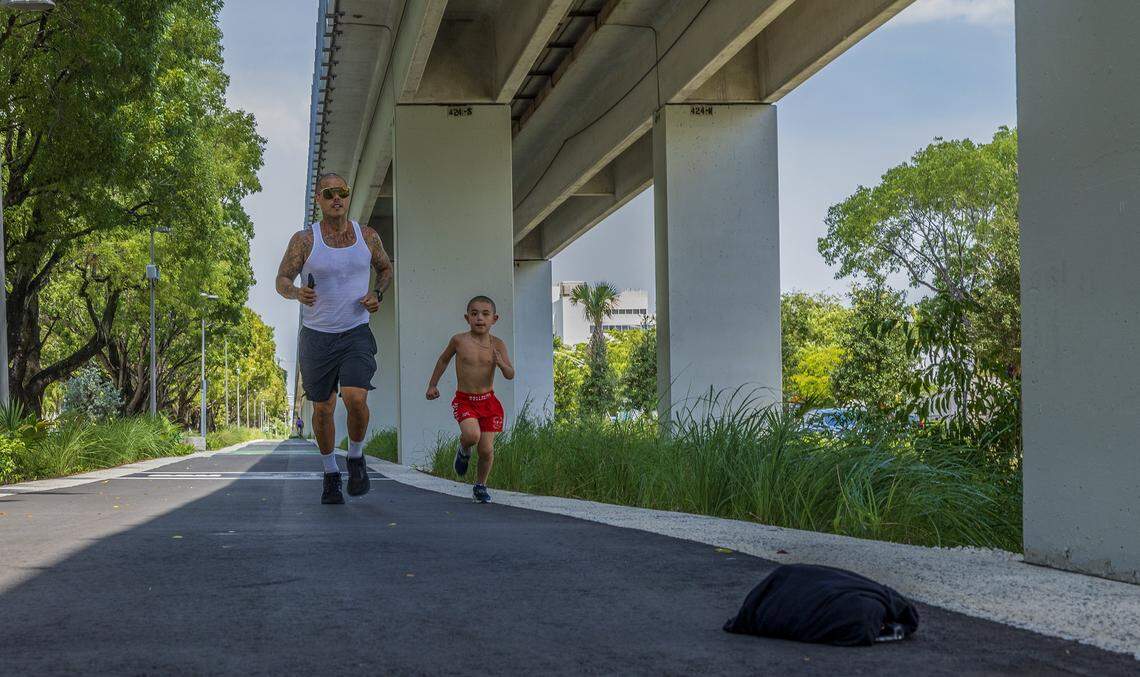 Louis González and his Max, 6 y.o, runs along the Underline extension at 22th Avenue, that extends between SW 19th Ave. - SW 27th Ave, on Wednesday, August 20, 2025. 