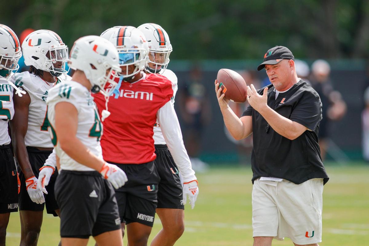 Miami Hurricanes defensive coordinator Lance Guidry talks to his players during spring practice at the University of Miami in Coral Gables, Florida, Saturday, March 4, 2023.