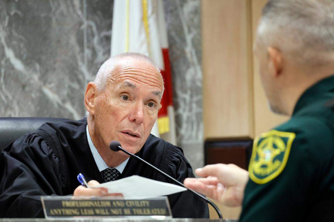 Judge John Murphy receives a question from the jury from Broward Sheriff’s Office court deputy Gary Toth in the trial of Jamell Demons, better known as rapper YNW Melly, at the Broward County Courthouse in Fort Lauderdale on Friday, July 21, 2023. Demons, 22, is accused of killing two fellow rappers and conspiring to make it look like a drive-by shooting in October 2018. (Amy Beth Bennett / South Florida Sun Sentinel)