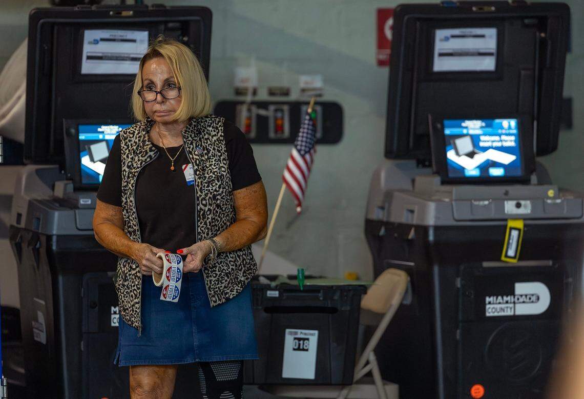 A poll worker holds a roll of “I Voted!” sticker during the general Election in Miami-Dade County at the Miami Beach Fire Station #4 on Tuesday, Nov. 5, 2024, in Miami Beach, Fla.