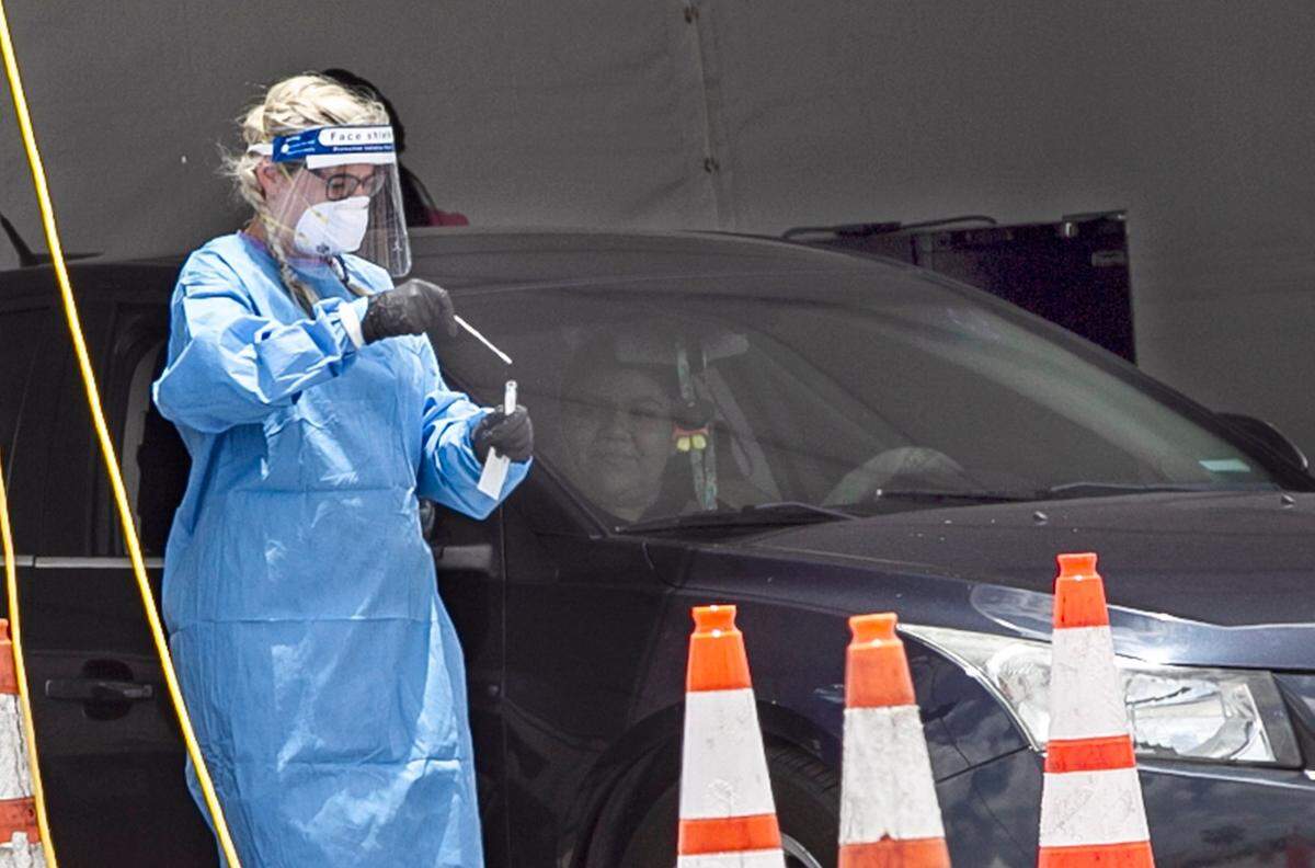 Long Lines are seen outside of Hard Rock Stadium Test Site as Florida Coronavirus numbers surge in Miami-Dade County, on Thursday, June 25, 2020.