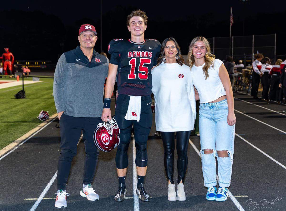 UM football quarterback commit Judd Anderson shown on 2023 Senior Day, from left, with his father Wade, mother Rachel and sister Georgia Mae. Greg Giedd Photography.