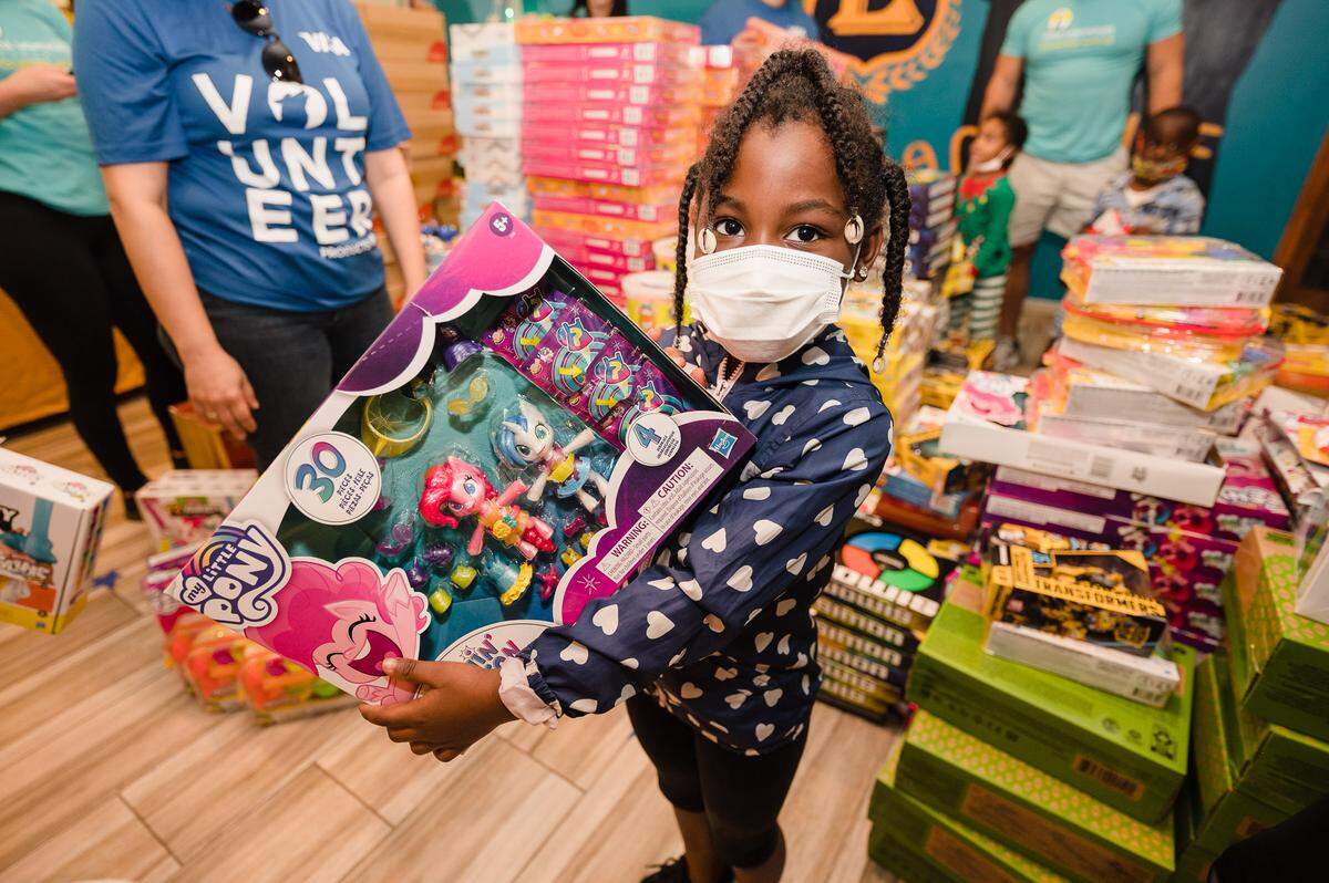 Excel Kids Academy student Sariyah Brown chose a “My Little Pony” gift at the Little Lighthouse Foundation’s 12th Annual Toy & Meal Distribution presented by Beyond Protocol.