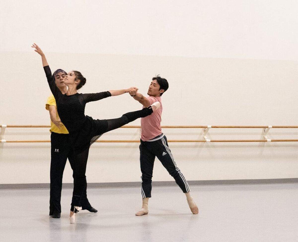 Anabel Katsnelson rehearsing an intricate pose with Guillermo Dominguez and Shimon Ito in “Heatscape” trio.