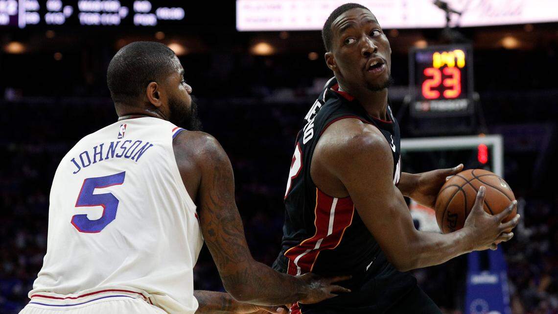 The Miami Heat's Bam Adebayo, right, in action against Philadelphia 76ers' Amir Johnson, left, during the first half in Game 1 of a first-round NBA basketball playoff series, Saturday, April 14, 2018, in Philadelphia. The 76ers won 130-103.