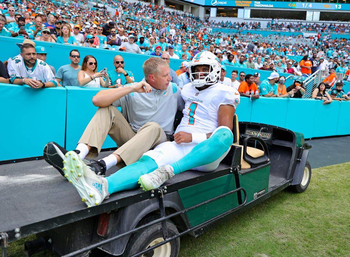 Miami Dolphins quarterback Tua Tagovailoa (1) carted out the field after getting injured in a play during first quarter of an NFL football game against the Buffalo Bills at Hard Rock Stadium on Sunday, September 19, 2021 in Miami Gardens, Florida.