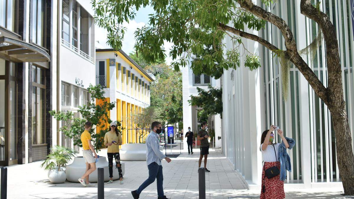 Visitors stroll along Paseo Ponti in the remade Miami Design District.