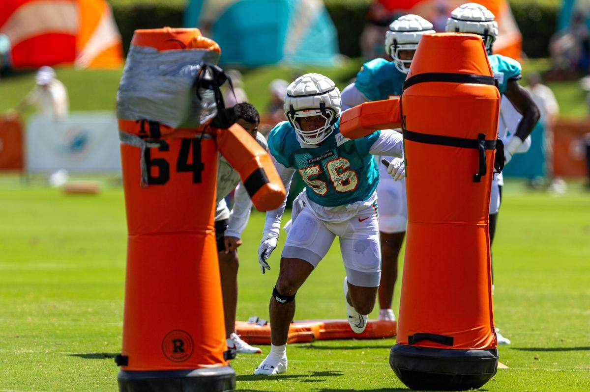 Miami Dolphins linebacker Quinton Bell (56) runs through a drill during Day 6 of training camp at Baptist Health Training Complex on Tuesday, July 30, 2024, in Miami Gardens, Fla.