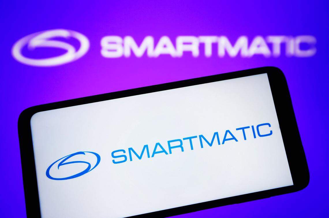 In this photo illustration, a Smartmatic logo is seen on a smartphone and on a pc screen. (Photo by Pavlo Gonchar / SOPA Images/Sipa USA)