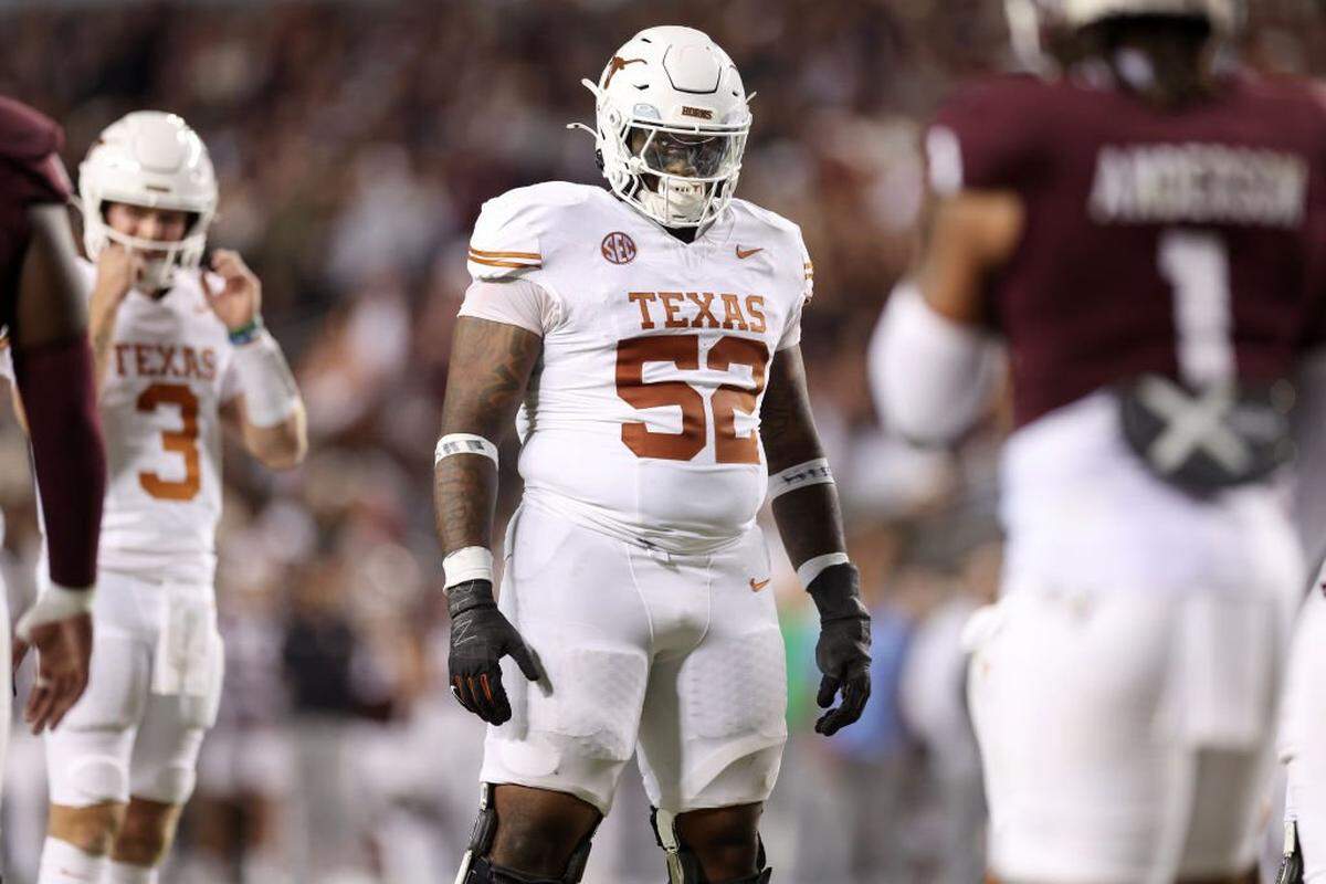 COLLEGE STATION, TEXAS - NOVEMBER 30: DJ Campbell #52 of the Texas Longhorns stands at the line of scrimmage in the first half against the Texas A&M Aggies at Kyle Field on November 30, 2024 in College Station, Texas. (Photo by Tim Warner/Getty Images)