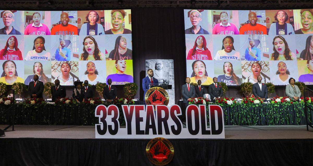 Toastmaster Jawan Strader, NBC 6 News anchor, center, stands as he pauses for the Black National Anthem, “Lift Every Voice and Sing,” is sung by HBCU singers from around the country, projected on large screens. The 5000 Role Models held its 33rd Annual Dr. Martin Luther King, Jr. Annual Scholarship Breakfast with Keynote Speaker Bishop Neil C. Ellis, and the 2026 Headliners consisting of Lee “Freezy Prince” Prince, Tramar “Flo Rida” Lacel Dillard, Maurice “Trick Daddy” Samuel Young, and Khaled “ DJ Khaled” Mohammed Khaled, on Monday, January 19, 2026, at the Miami Beach Convention Center, in Miami Beach, Florida. 