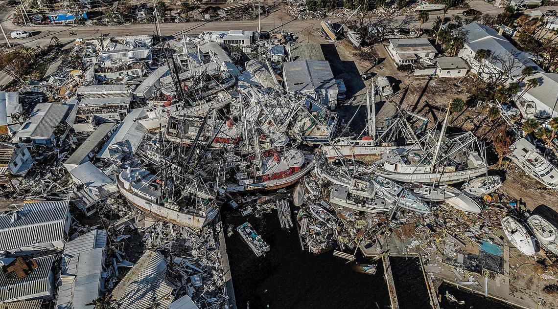 A mass of shrimp boats and recreational vessels is piled on docks on San Carlos Island in Fort Myers Beach Wednesday, Oct. 26, 2022. The large boats were wrecked and displaced during Hurricane Ian, which hit the area as a Category 4 storm Wednesday, Sept. 28, 2022.