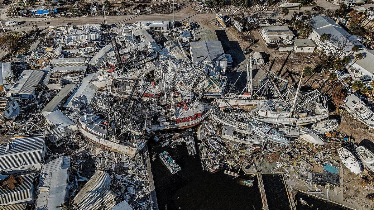 A mass of shrimp boats and recreational vessels is piled on docks on San Carlos Island in Fort Myers Beach Wednesday, Oct. 26, 2022. The large boats were wrecked and displaced during Hurricane Ian, which hit the area as a Category 4 storm Wednesday, Sept. 28, 2022.