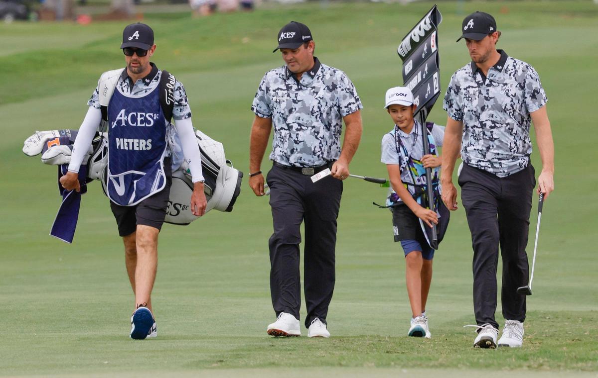 Patrick Reed and Thomas Pierters of the 4Aces GC, walk to the 9th hole during LIV Golf Miami at Trump National Doral in Doral, Florida on Friday, April 4, 2025.