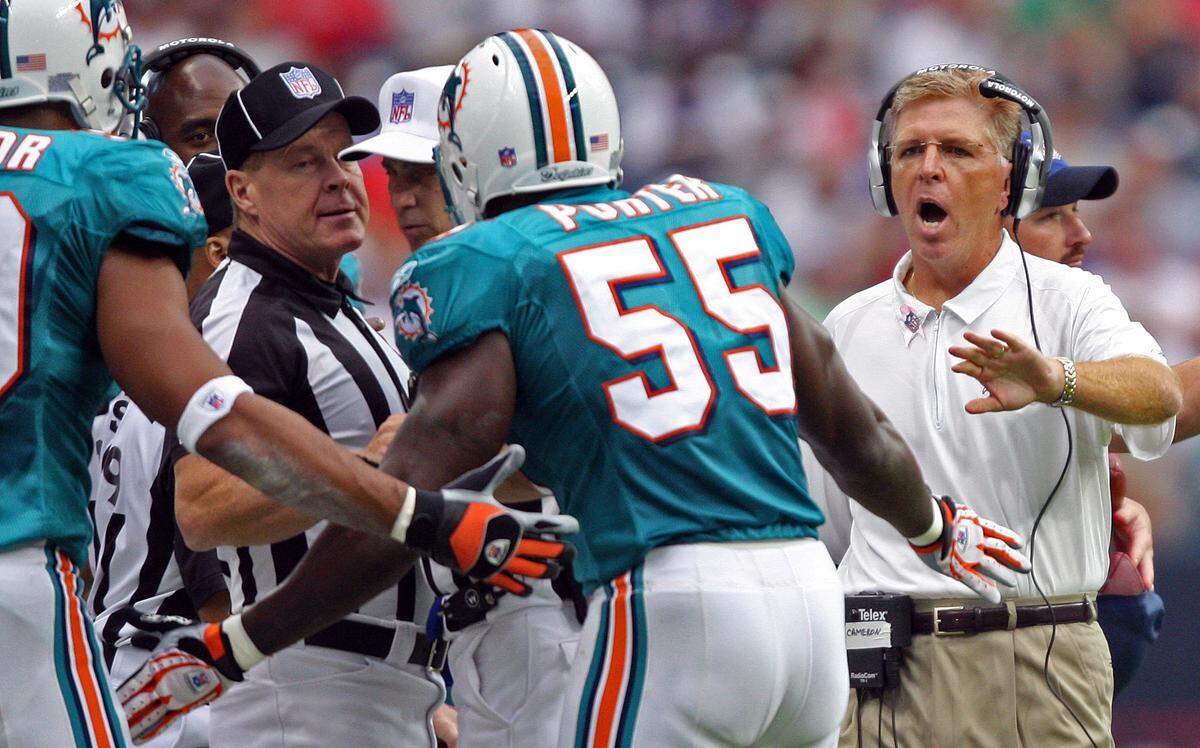 The Houston Texans host the Miami Dolphins at Reliant Stadium in Houston on Oct. 7, 2007. Cam Cameron yells at Joey Porter and Jason Taylor to get away from the referees after Jason was called for a late hit in the 1st quarter.