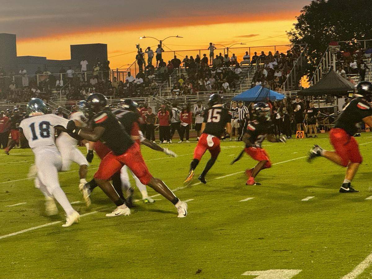 Southridge quarterback James Perrone (15) drops back to pass during Friday night’s 21-7 win over Palmetto at Southridge Stadium.