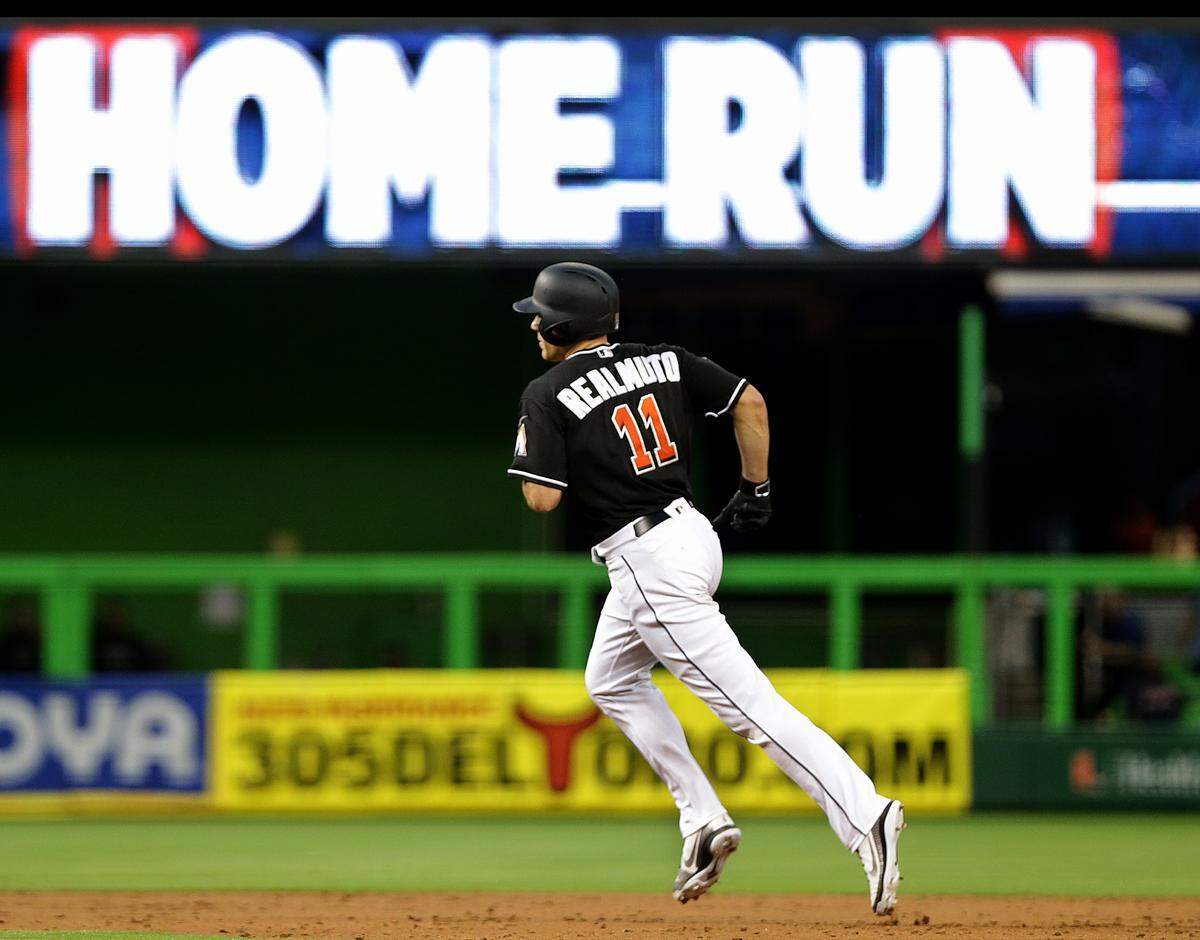 Marlins catcher J.T. Realmuto hits a solo home ru in the third  inning of the Miami Marlins vs Atlanta Braves game at Marlins Park, Friday, May 11, 2018.