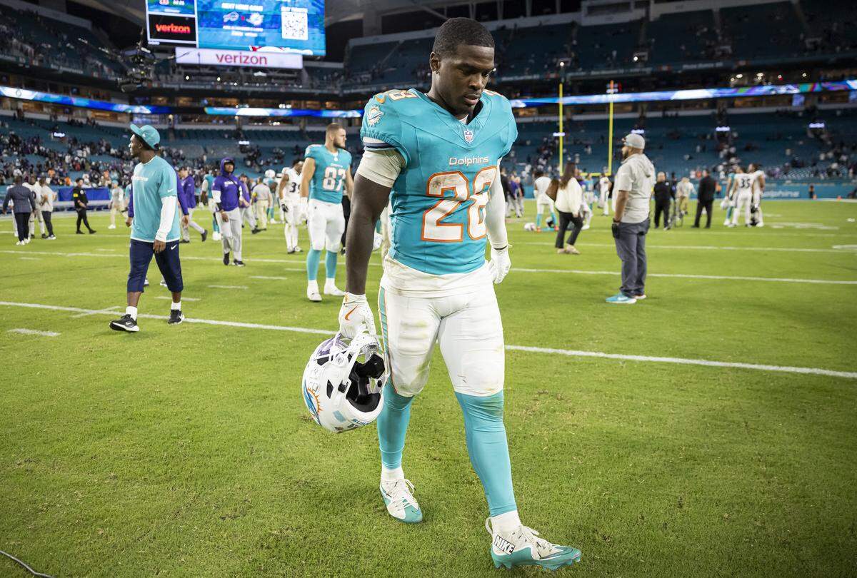 Miami Dolphins running back De'Von Achane (28) walks off the field after losing against the Baltimore Ravens in their NFL game at Hard Rock Stadium on Thursday, Oct. 30, 2025, in Miami Gardens, Fla.