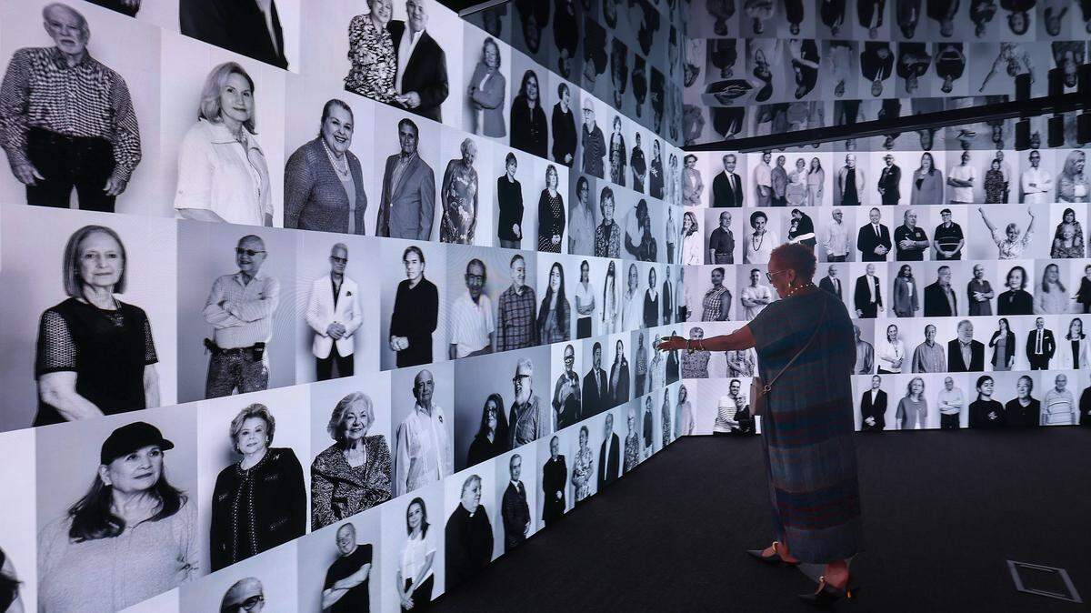 Rosie Gordon-Wallace, a recognized curator, community leader, and pioneer in advancing contemporary Caribbean diaspora, excitedly finds her photo among four hundred portraits of Miami residents inside the exhibit “Voices of Miami” photographed by documentary photographer Clara Toro. The exhibition captured portraits in both sight and sound in celebration of Miami's diverse identity. Miami Dade College's Freedom Tower gave a preview to VIP and special guests before its public opening in celebration of its centennial after 2 years of renovation on Tuesday, September 16, 2025, in downtown Miami, Florida.