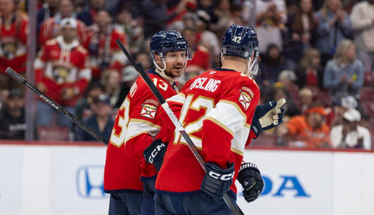 Florida Panthers center Sam Reinhart (13) celebrates with defenseman Gustav Forsling (42) after scoring a goal against Boston Bruins goaltender Jeremy Swayman (1) in the third period of their NHL game at Amerant Arena on Saturday, Jan. 11, 2025, in Sunrise, Fla.