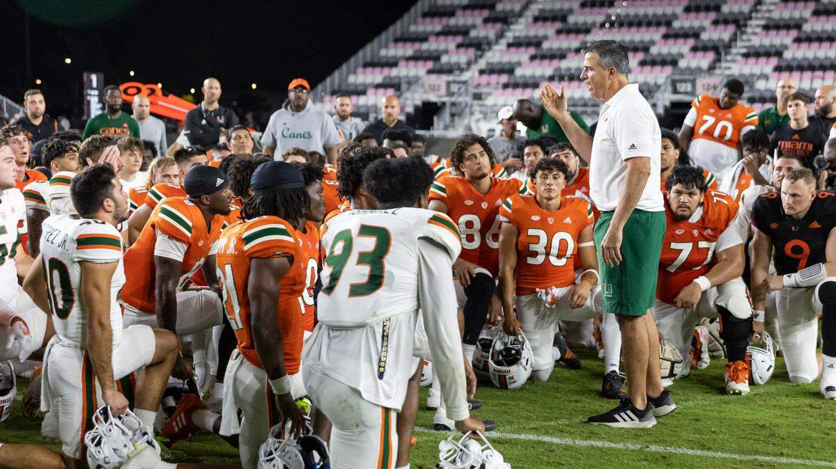 Miami Hurricanes head coach Mario Cristobal talks to his team after they finished their spring game at DRV PNK Stadium on Friday, April 14, 2023, in Fort Lauderdale, Fla.