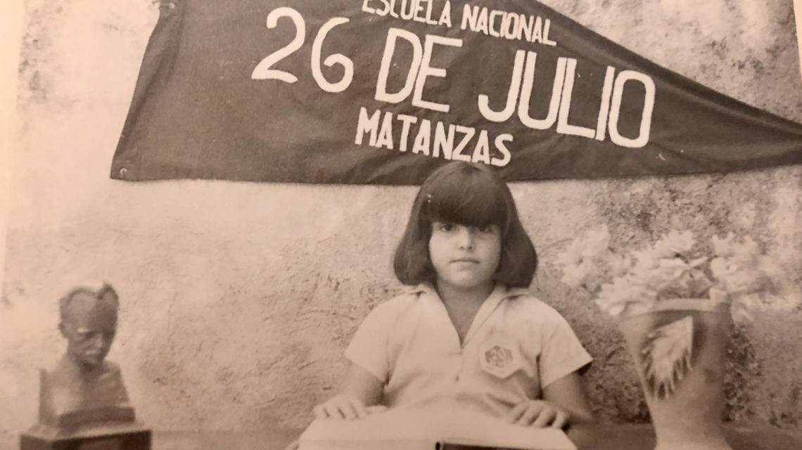 Miami Herald columnist Fabiola Santiago, pictured in third grade in Cuba, was ostracized for not wearing her school uniform with the required scarf of the young Communist pioneers.