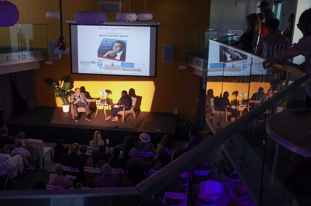 Andrew Young, left stage, speaks about the Civil Rights Movement, his political accomplishments as mayor of Atlanta, his relationship with Jimmy Carter and with Martin Luther King Jr. on Sunday, Feb. 19, 2023, at the Historic Hampton House in Miami, Florida. He was interviewed by Miami Herald senior reporter Jacqueline Charles during the Black History Month event.