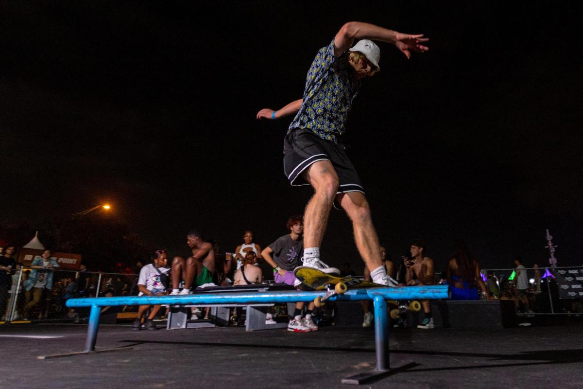 A skateboarder performs a boardslide on a rail inside a mini skatepark created for Rolling Loud Miami 2023 at Hard Rock Stadium in Miami Gardens, Florida, on Saturday, July 22, 2023.