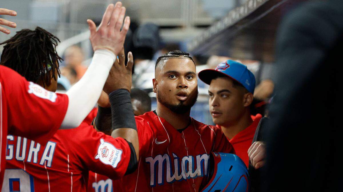 Jun 3, 2023; Miami, Florida, USA; Miami Marlins second baseman Luis Arraez (3) celebrates scoring against the Oakland Athletics during the second inning at loanDepot Park. Mandatory Credit: Rhona Wise-USA TODAY Sports