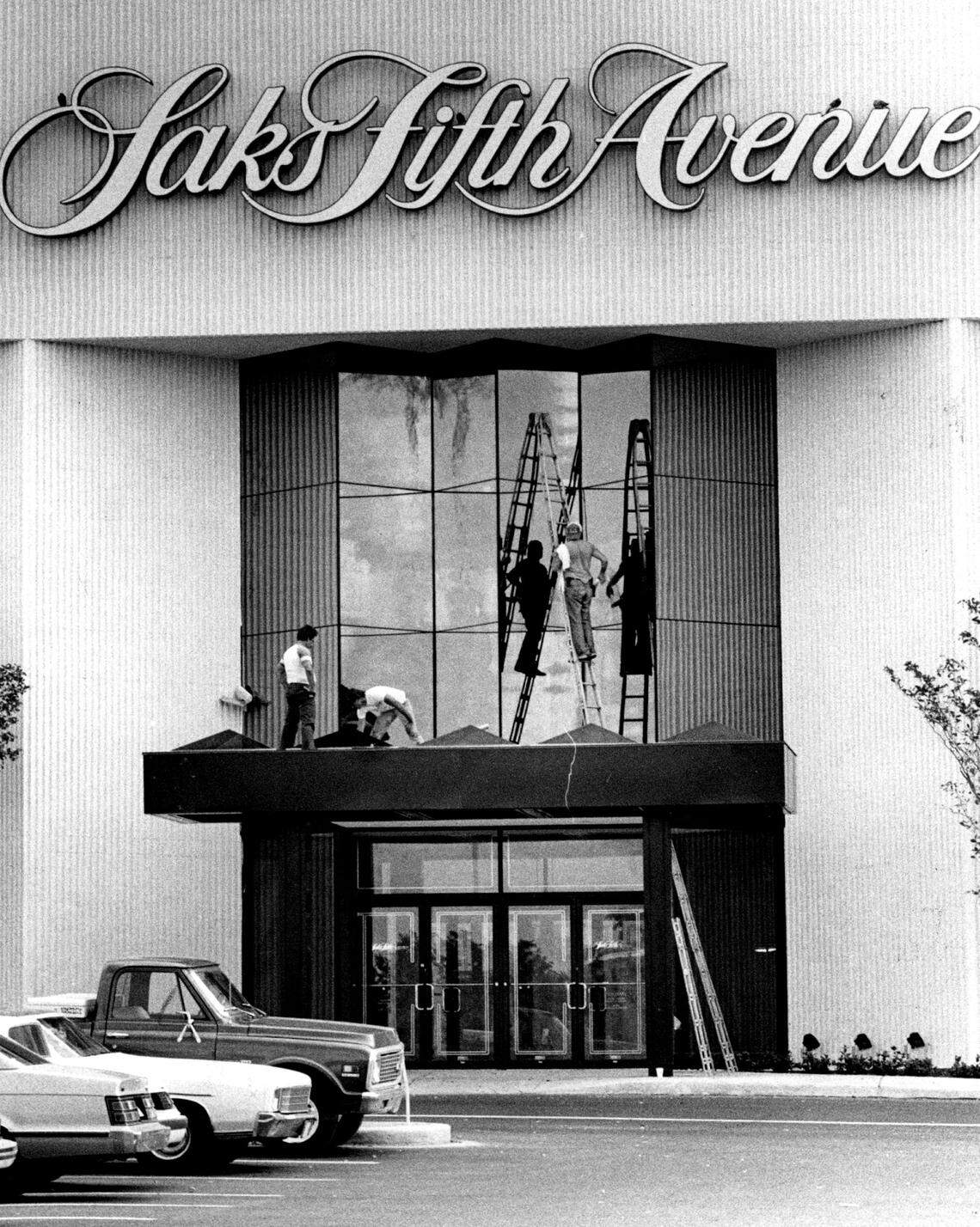Window washers work on the Saks in Dadeland Mall in the early 1980s.