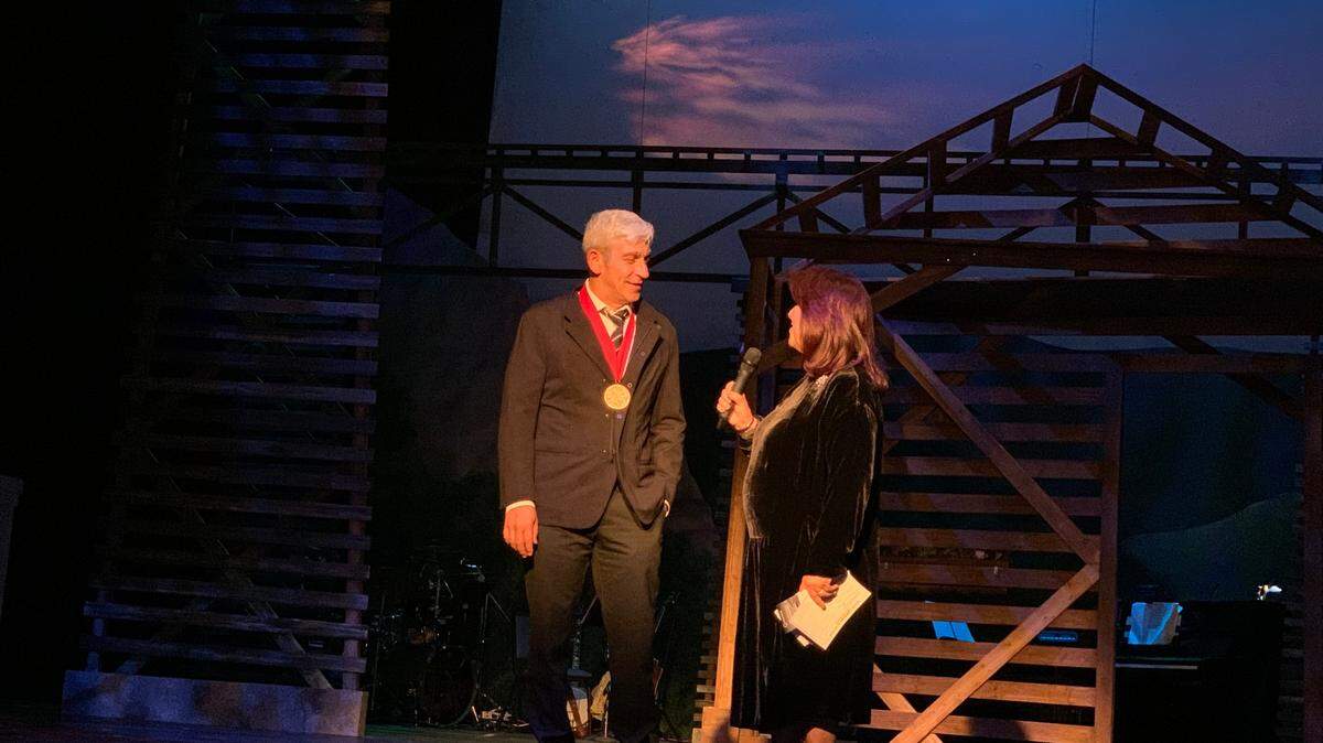 Actors’ Playhouse founding executive producing director Barbara Stein (right) tells an opening night audience that Miami-raised inaugural poet Richard Blanco (left) would see the Florida premiere of his play ““Sweet Goats & Blueberry Señoritas” open the Coral Gables Miracle Theatre’s 36th season on Nov. 8-Dec. 3, 2023.