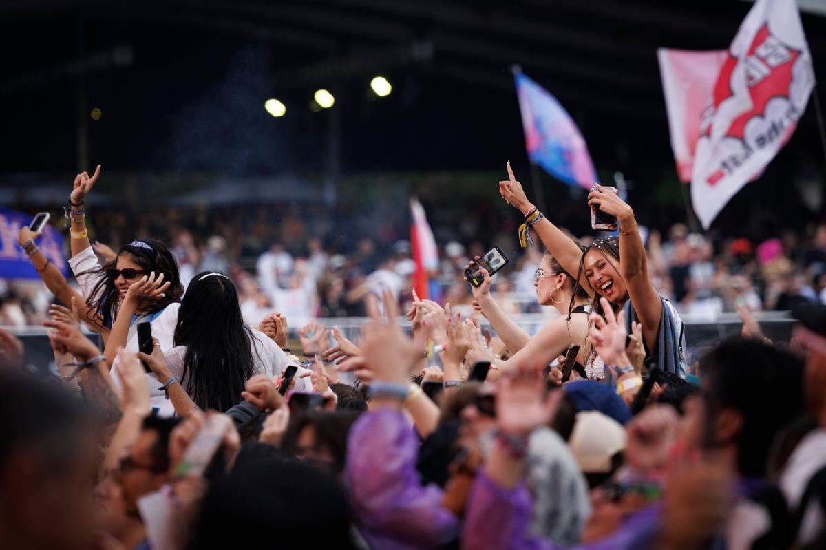 Fans dance to Swae Lee after he gets brought on stage as a guest with DJ Steve Aoki on the Main Stage during the third day of Ultra Music Festival on Sunday, March 30, 2025, at Bayfront Park in downtown Miami, Fla. 