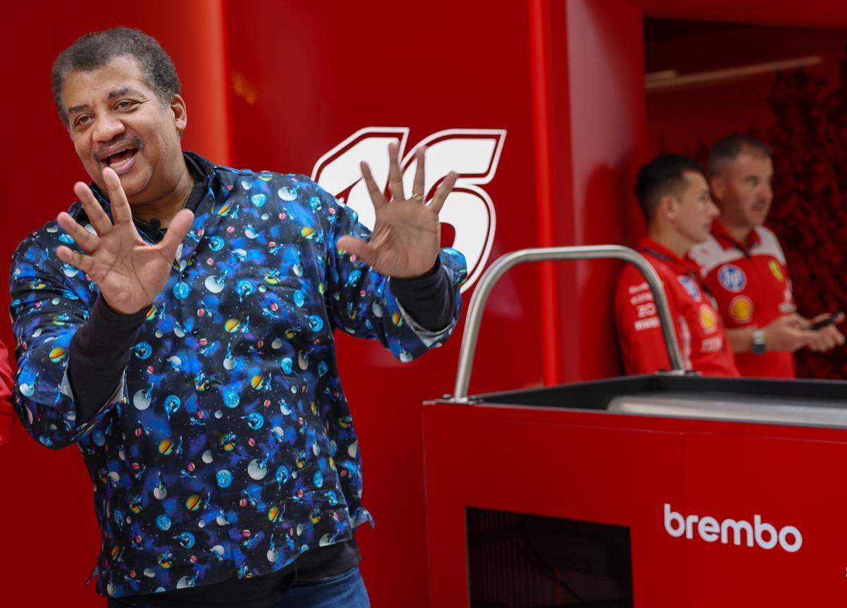 Physicist Neil Degrassi Tyson talks the science of Formula 1 racing with Ferrari’s engineer at the Paddock prior to the Sprint Race on the second day of the Formula One Miami Grand Prix at the Miami International Autodrome on Saturday, May 2, 2026, in Miami Gardens, Fla.