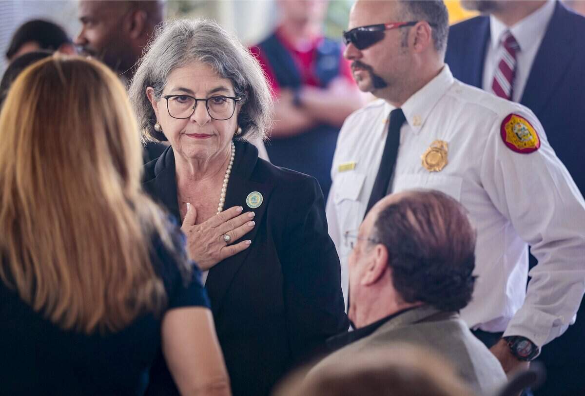 Miami-Dade Mayor Daniella Levine Cava gestures her support and offers condolences upon arrival at Surfside’s fifth annual Remembrance event on Wednesday, June 24, 2026, in Surfside, Fla. The ceremony honors the 98 people killed in the Champlain Towers South building collapse.