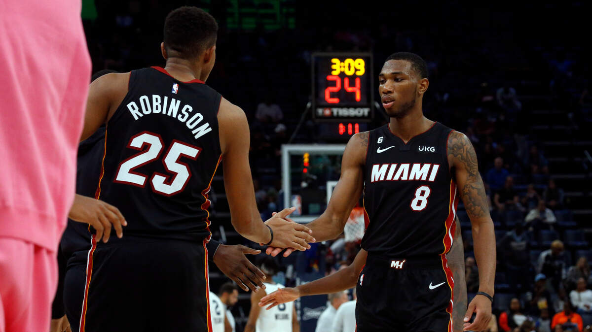 Miami Heat center Orlando Robinson (25) and forward Jamal Cain (8) five during the second half against the Memphis Grizzlies at FedExForum.