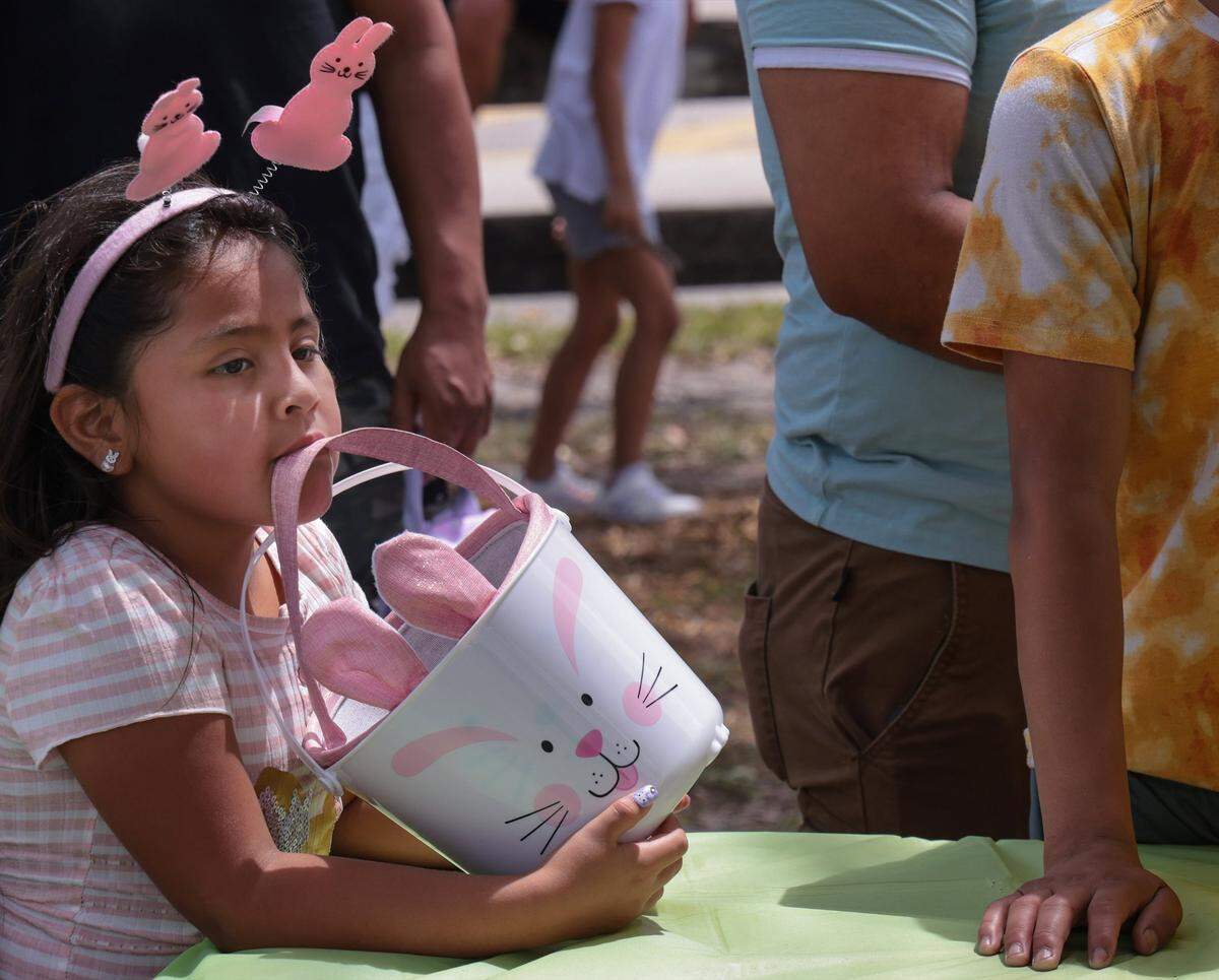 Miami resident Sophia Botelo, 4, waits for her wristband before entry to the Miami Gardens Easter Day Eggstravaganza.
