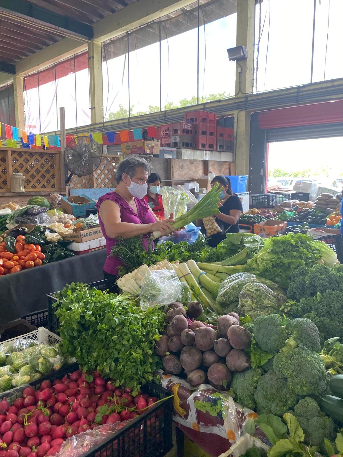 A masked shopper at the Redland Market Village located on 27 acres in Homestead, 24420 S. Dixie Hwy. Open from 11 a.m. to 6 p.m. Thursday-Fridays, from 7 a.m. to 6 p.m., Saturday-Sunday.