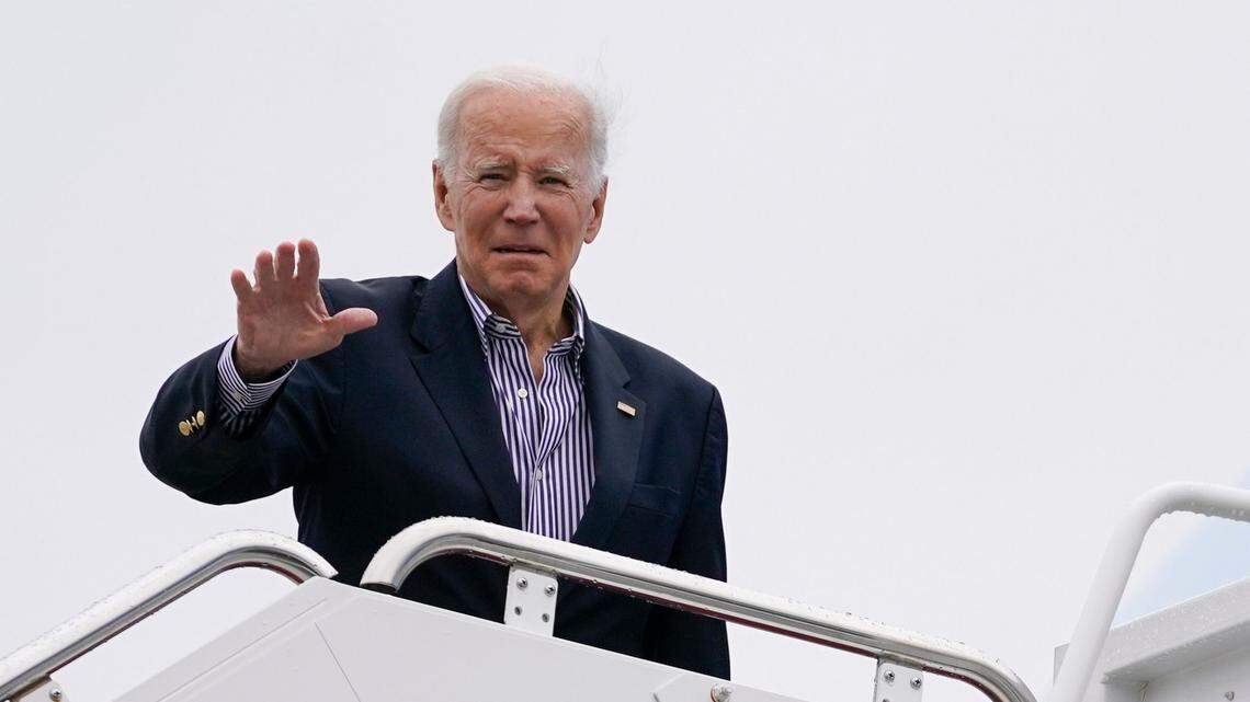 President Joe Biden waves before boarding Air Force One for a trip to Florida to visit areas impacted by Hurricane Ian, Wednesday, Oct. 5, 2022, in Andrews Air Force Base, Md.