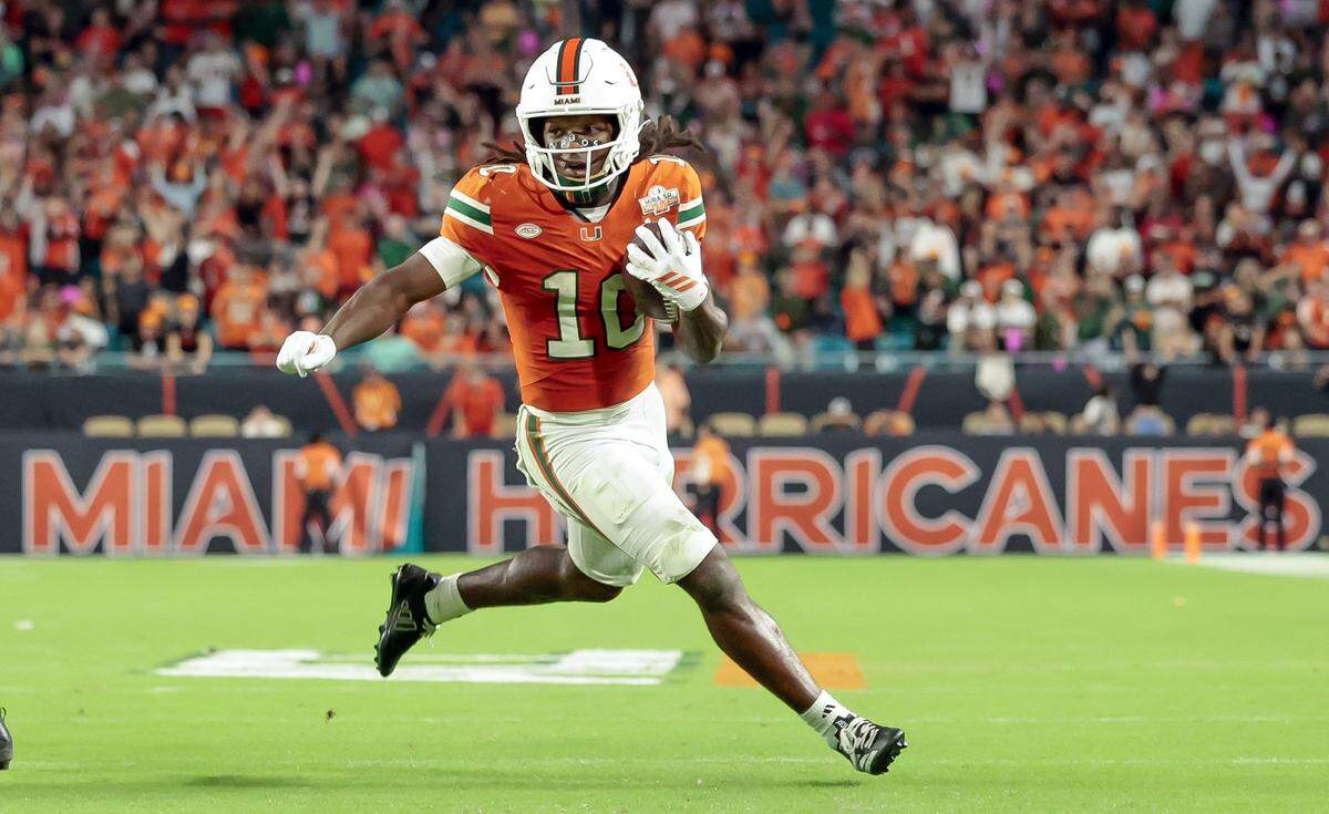 Miami Hurricanes wide receiver Malachi Toney (10) runs in to score against the Louisville Cardinals in the second half of their NCAA football game at Hard Rock Stadium in Miami Gardens, Florida, on Friday, October 17, 2025. 