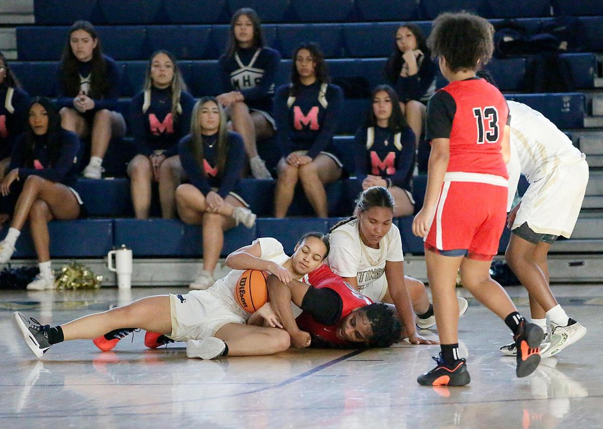 Miami High and Southridge players fight for the ball during the GMAC girls’ basketball final Saturday, January 25, 2025 at Miami Senior HS in Miami.